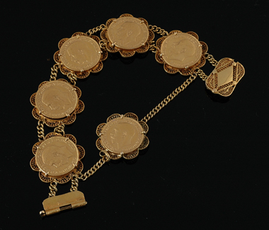 Appraisal: A gold sovereign bracelet Comprising six gold sovereigns mounted in