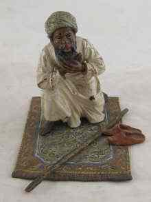 Appraisal: An Austrian cold painted bronze of an Arab carpet vendor