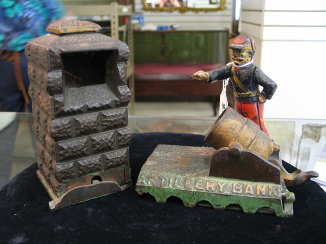 Appraisal: AN AMERICAN CAST IRON AND PAINTED MECHANICAL BANK titled Artillery