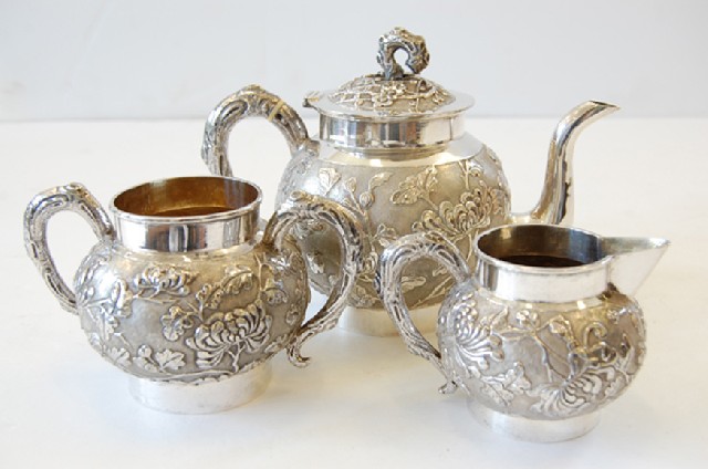 Appraisal: CHINESE SILVER THREE PIECE TEA SET LATE TH CENTURY