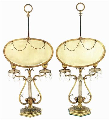 Appraisal: A pair of gilt brass twin light table lamps the