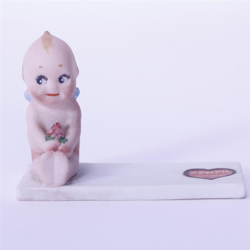 Appraisal: Rose O'Neill German Bisque Kewpie Doll Figure seated on place