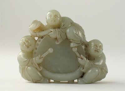 Appraisal: A Chinese pale celadon jade carving of a drum surrounded