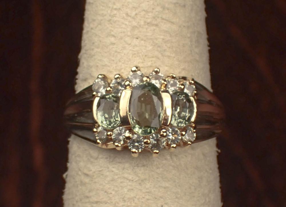 Appraisal: GREEN SAPPHIRE AND YELLOW GOLD RING The k gold ring