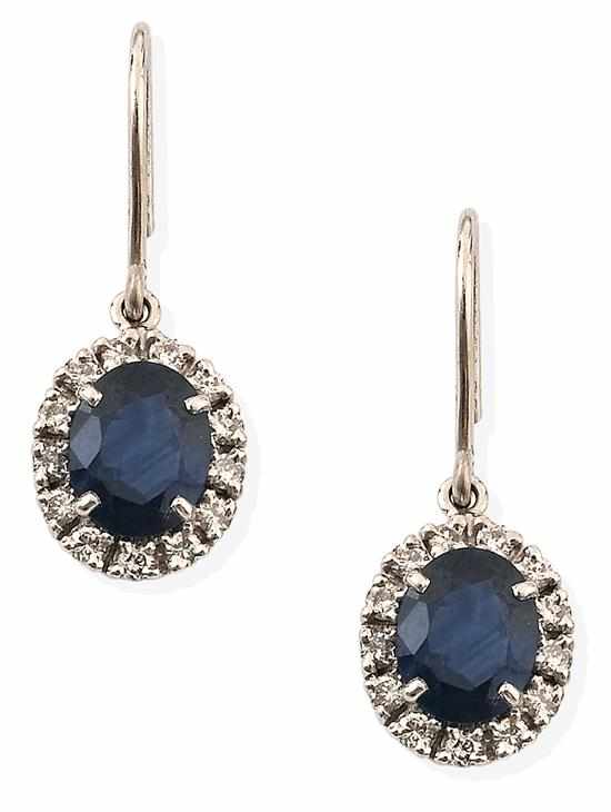 Appraisal: A PAIR OF SAPPHIRE AND DIAMOND EARRINGS Of cluster design