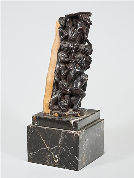 Appraisal: Carved wood African stand depicting figures on stone base x