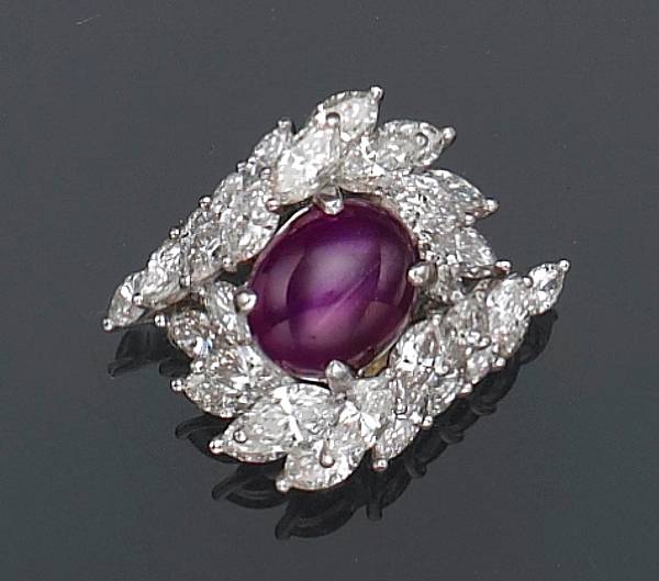 Appraisal: centering a star ruby encircled by a wrapping wreath motif