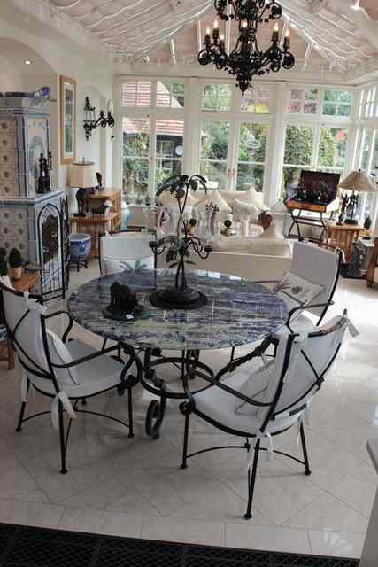 Appraisal: A CIRCULAR BLUE STRIATED MARBLE TOPPED CONSERVATORY TABLE possibly lapis