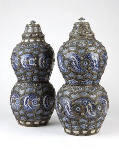 Appraisal: Near pair of Moroccan metal Early th century each surmounted