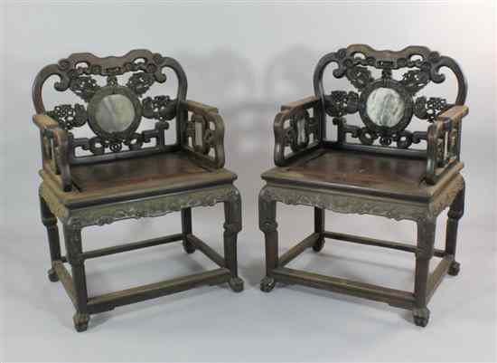 Appraisal: A pair of late th century Chinese carved hardwood marble