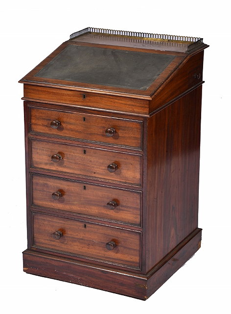 Appraisal: A GEORGE IV MAHOGANY DAVENPORT the swivelling top with brass