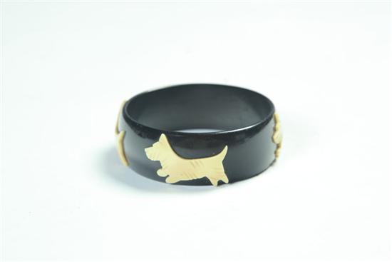 Appraisal: BAKELITE BRACELET American Ca - Black bangle bracelet with applied