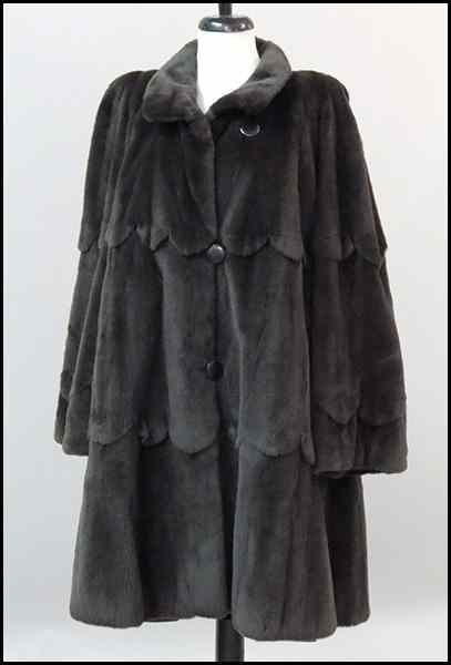 Appraisal: CHARCOAL SHEARED MINK REVERSABLE SWING COAT With scalloped tiered layers