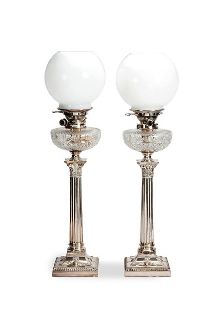 Appraisal: A PAIR OF TH CENTURY OIL LAMPS with globular white