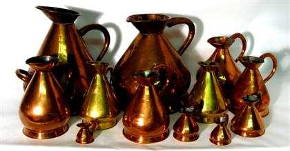 Appraisal: Seven copper and brass graduated Naval rum measures sizes gallons