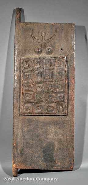 Appraisal: An Indonesian Carved Wood Granary Door the thick slab deeply