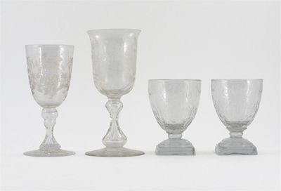 Appraisal: A pair of glass goblets each bowl engraved with the