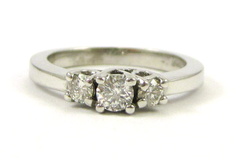 Appraisal: DIAMOND AND FOURTEEN KARAT WHITE GOLD RING set with three