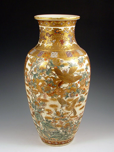 Appraisal: JAPANESE SATSUMA EARTHENWARE VASE Bird and blossom decoration worn gold