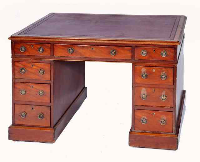 Appraisal: A VICTORIAN MAHOGANY PEDESTAL DESK the top with red leather