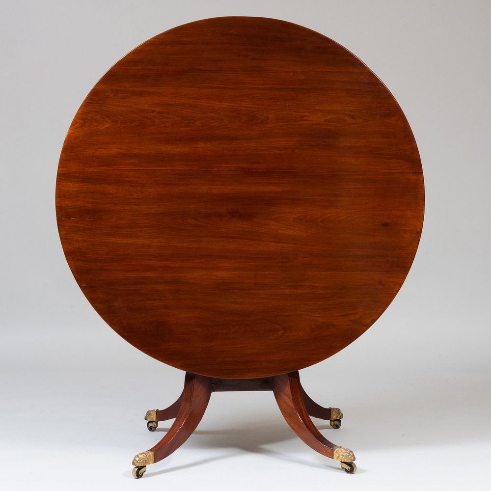 Appraisal: Regency Mahogany Tilt-Top Center Table Raised on casters x in