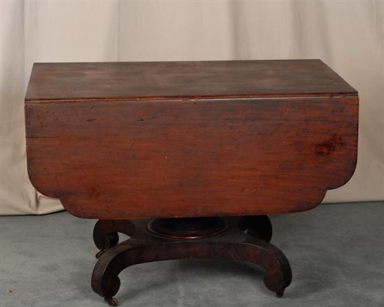 Appraisal: An American Empire Mahogany Dropleaf Breakfast Table having rolled aprons