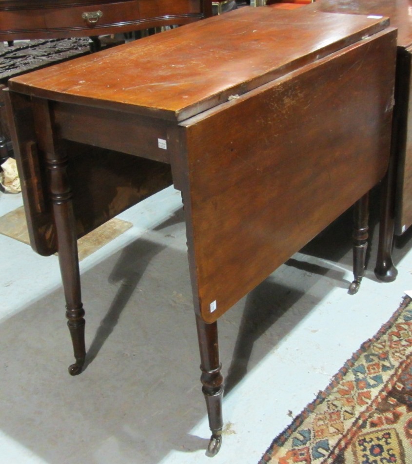 Appraisal: A th century stained pine drop flap table