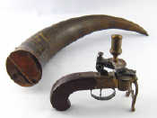 Appraisal: A table pistol flintlock tinder igniter with candlestick having mahogany