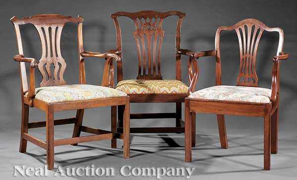 Appraisal: Three Associated Georgian Carved Mahogany Armchairs th c each with