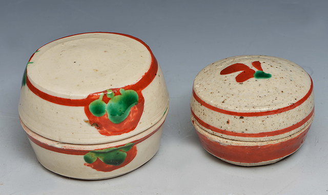 Appraisal: John Maltby British b Two pots and coverseach with red