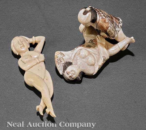 Appraisal: Two Japanese Ivory Figural Okimomo including an amorous couple carved