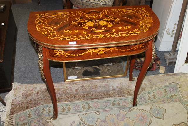 Appraisal: AN ITALIANATE REPRODUCTION FOLD-OVER CARD TABLE with gilt metal mounts