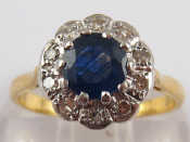 Appraisal: A yellow metal tests carat gold sapphire and diamond ring