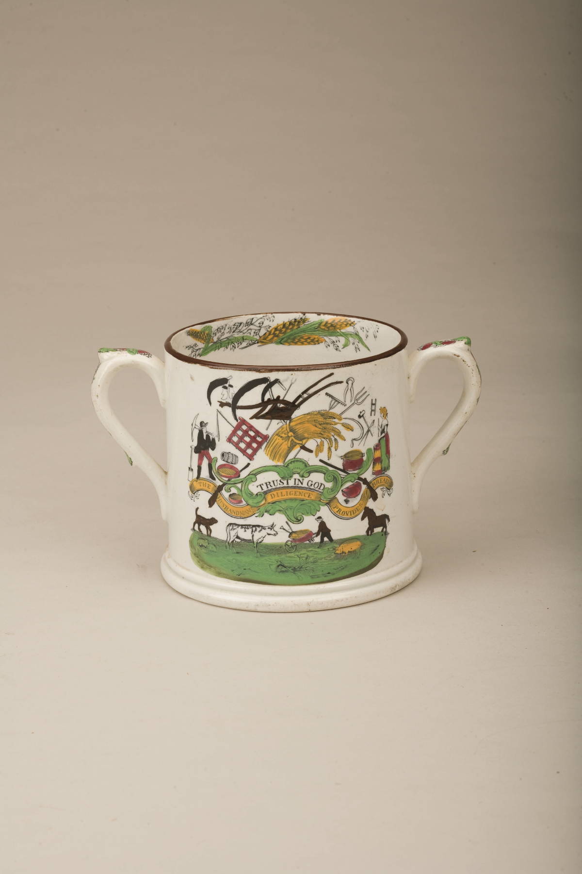 Appraisal: STAFFORDSHIRE ENAMEL-DECORATED AND BLACK TRANSFER-PRINTED TWO-HANDLED MUG CIRCA - Printed