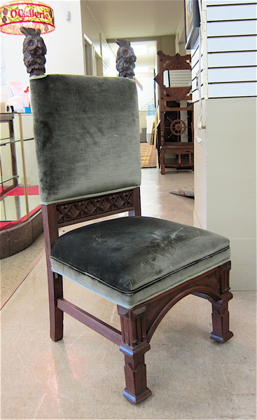 Appraisal: CARVED AND UPHOLSTERED OAK HALL CHAIR American c the square