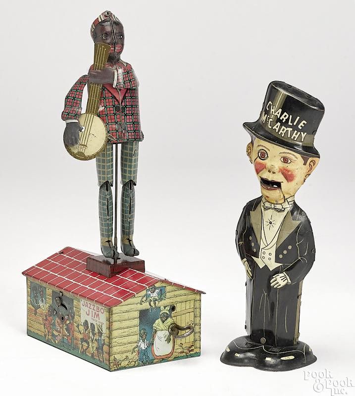 Appraisal: Two American tin lithograph clockwork toys Two American tin lithograph