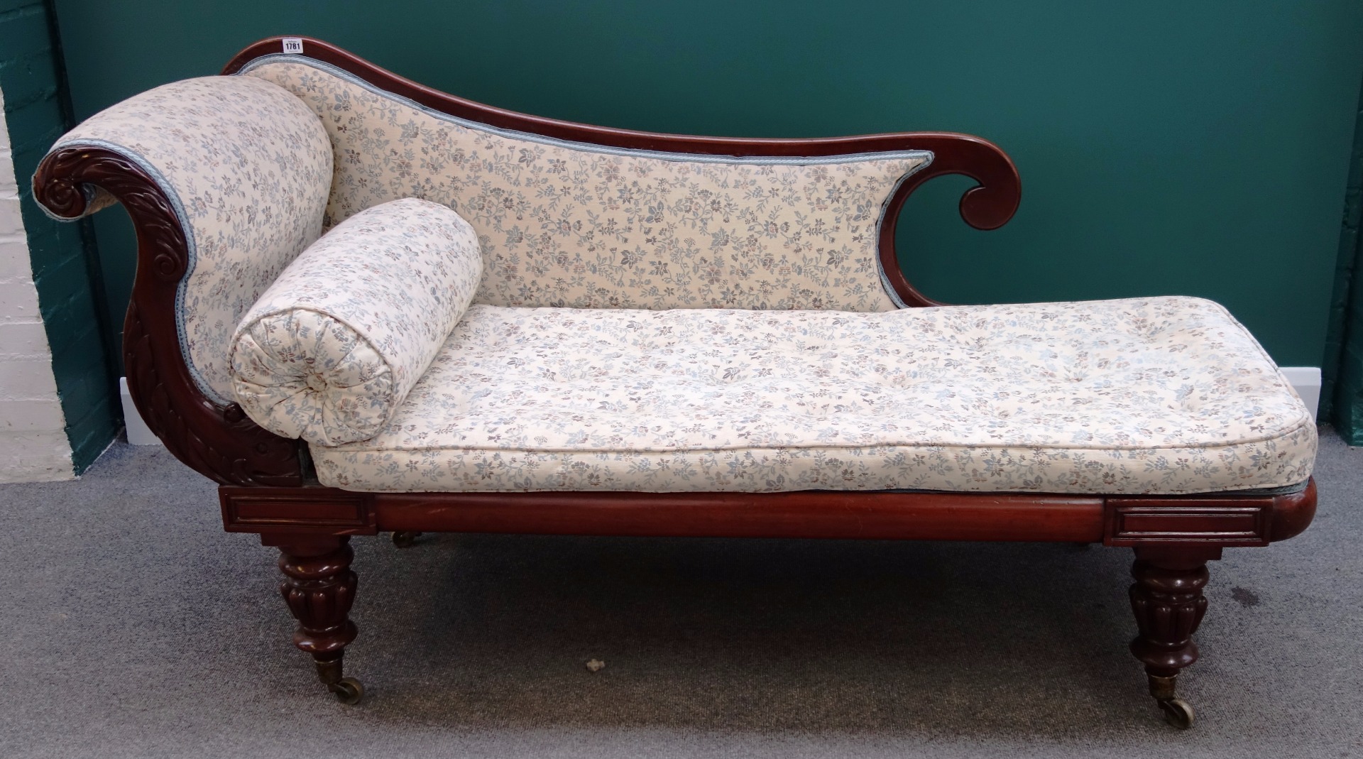 Appraisal: A Victorian mahogany framed chaise longue with scroll end on