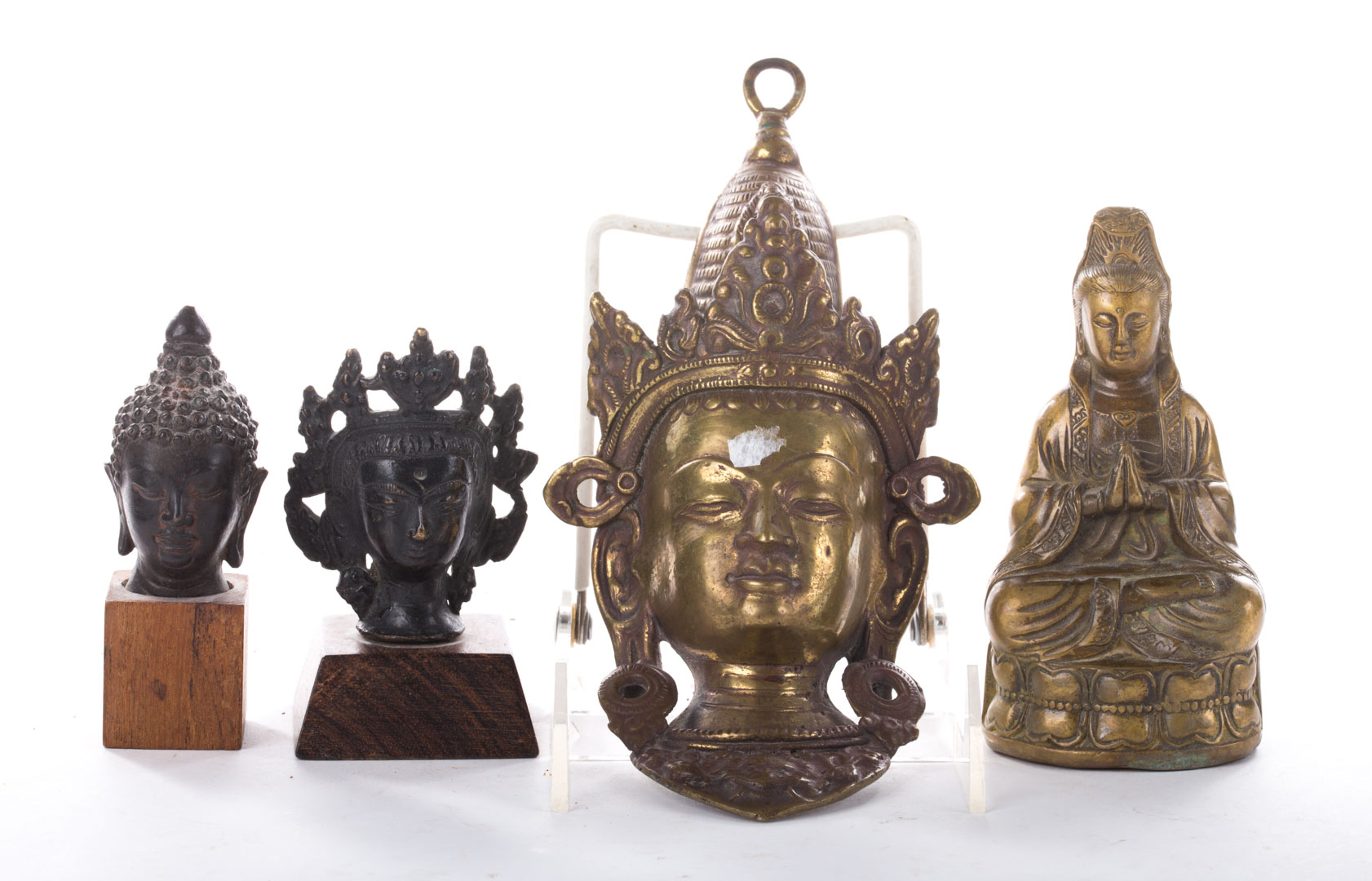 Appraisal: Three Thai metal busts and a Chinese metal figure to