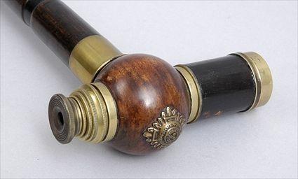 Appraisal: BAMBOO CANE WITH BRASS COLLAPSIBLE TELESCOPE HANDLE The handle with