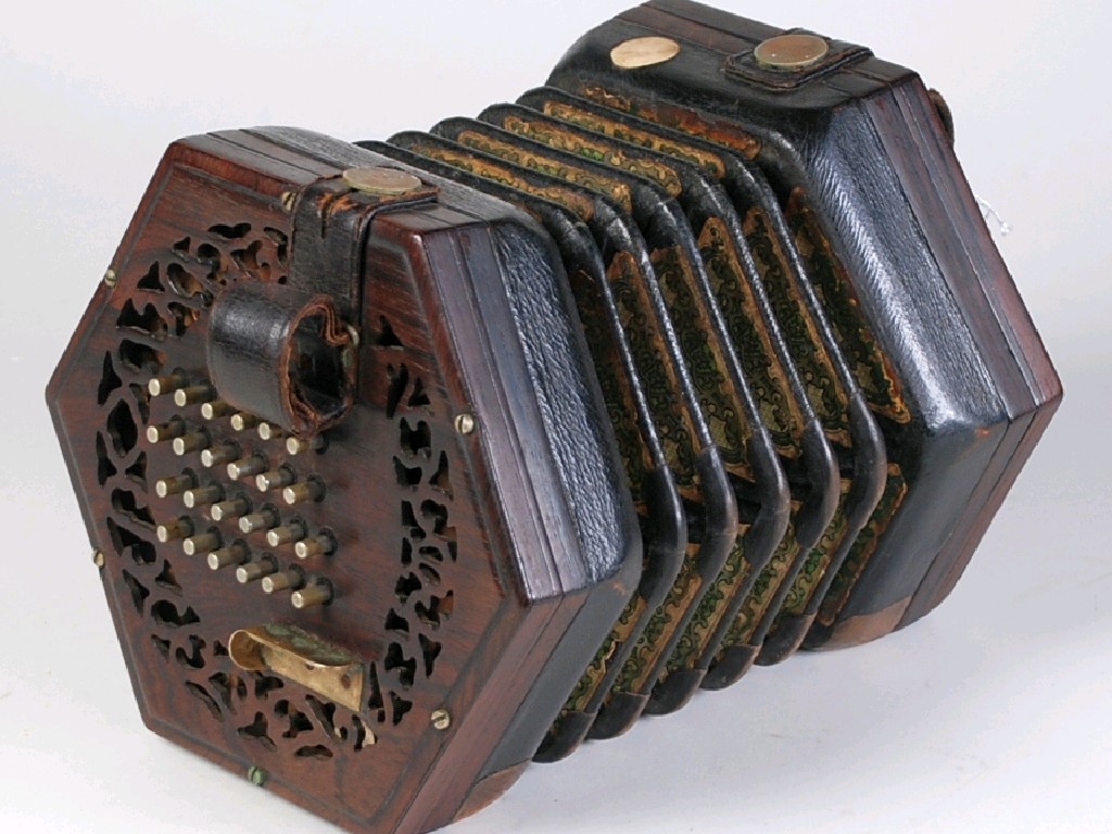 Appraisal: UNBRANDED CONCERTINA with fret pierced rosewood hexagonal ends with metal