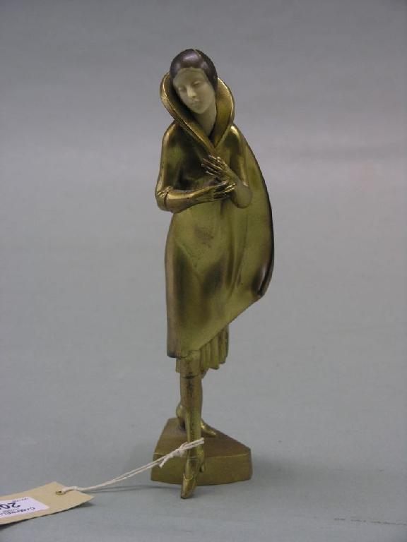 Appraisal: An Art Deco period gilt-metal statuette young female wearing three-quarter