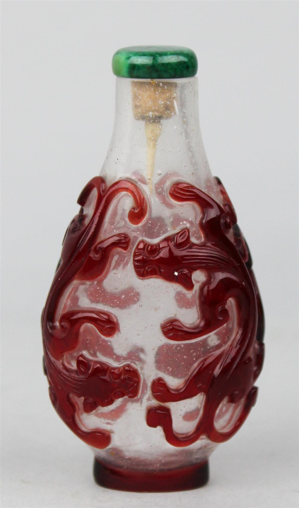 Appraisal: CHINESE RED AND CLEAR BEIJING GLASS SNUFF BOTTLE of flattened