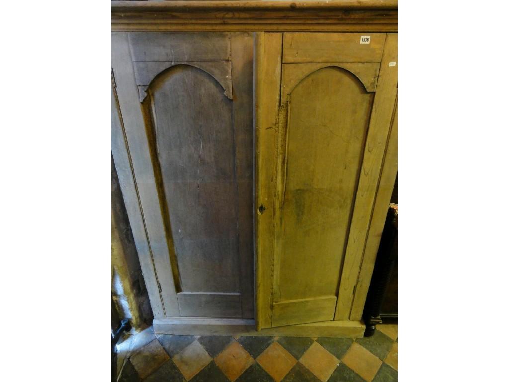 Appraisal: A Victorian stripped pine side cupboard enclosed by a pair