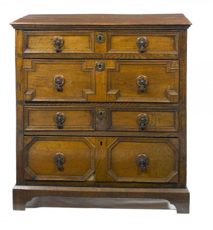 Appraisal: A QUEEN ANNE OAK GEOMETRIC MOULDED CHEST OF DRAWERS with