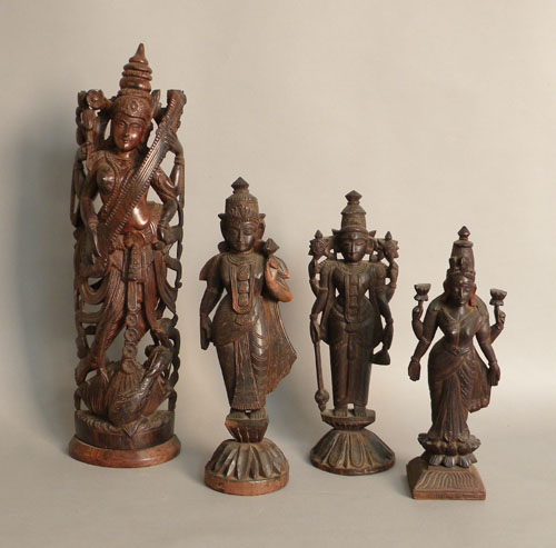 Appraisal: Four carved wood Hindu figures h h h and h