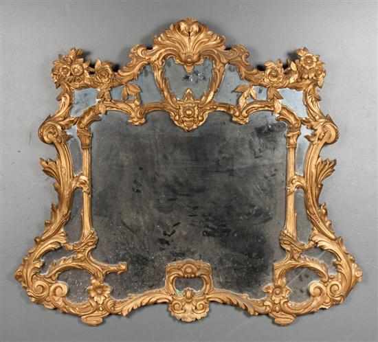 Appraisal: Continental giltwood mirror elaborate scroll floral and acanthus carving x