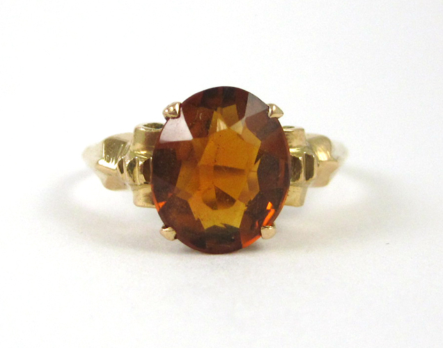 Appraisal: ORANGE CITRINE AND FOURTEEN KARAT GOLD RING set with a