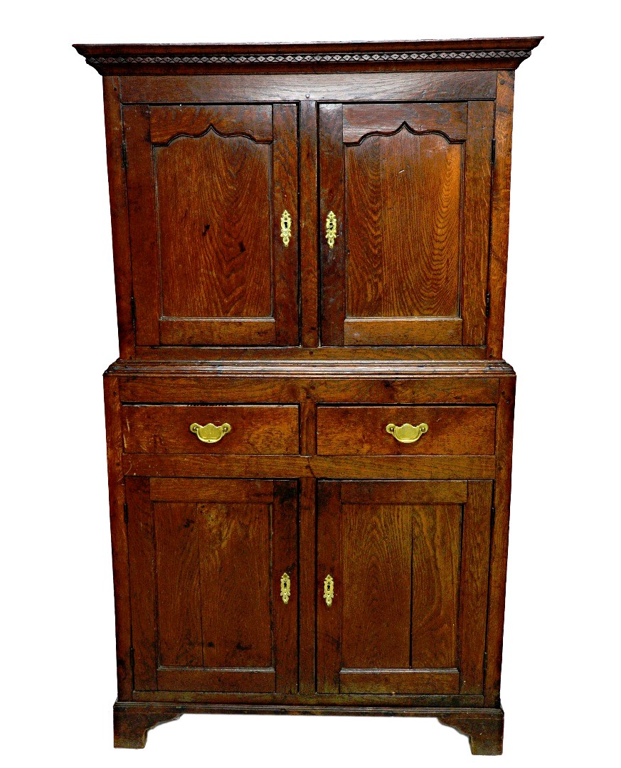 Appraisal: An th century oak side cupboard the diamond carved cornice