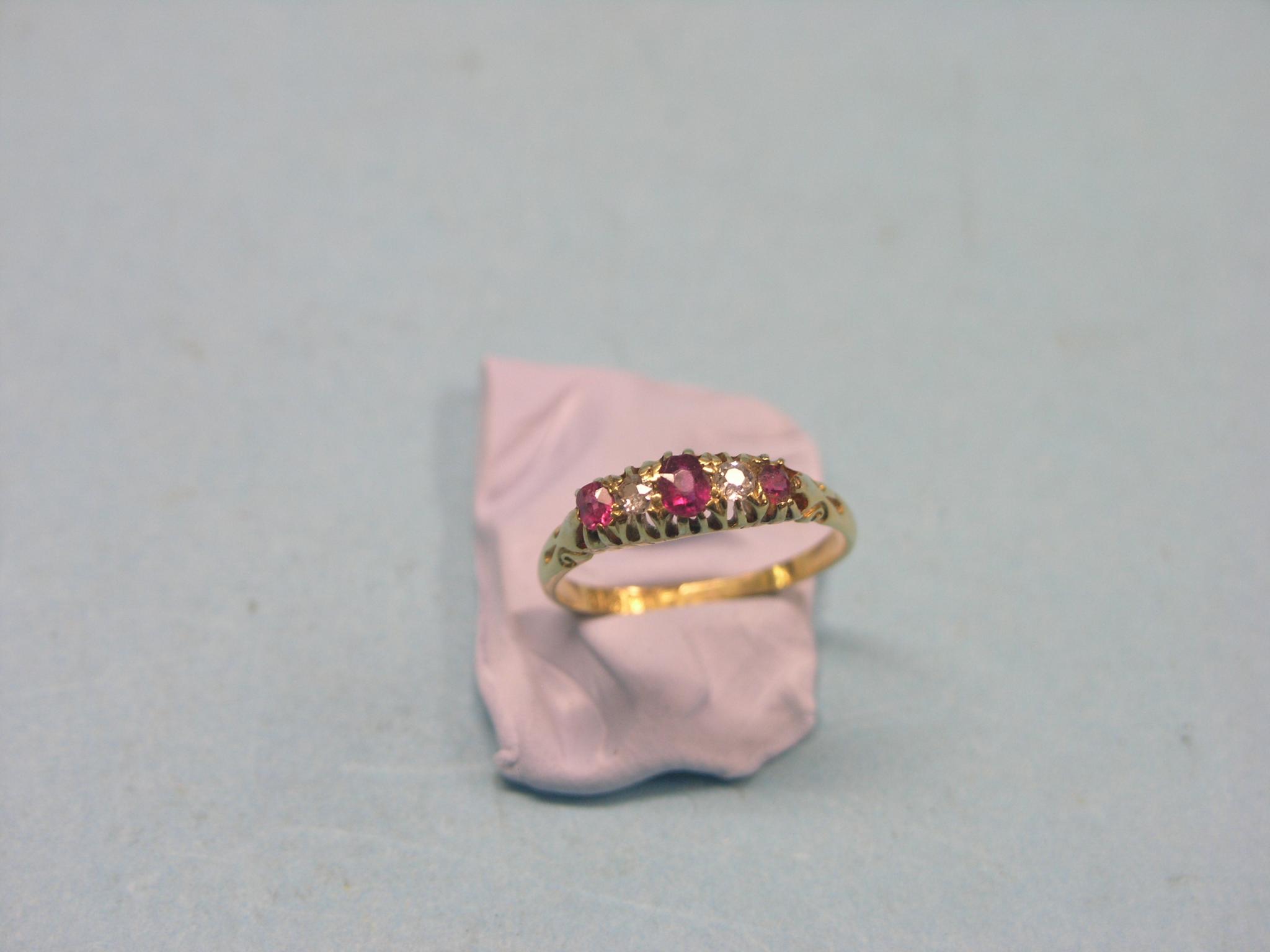 Appraisal: An ct gold half-hoop ring three rubies two diamonds claw