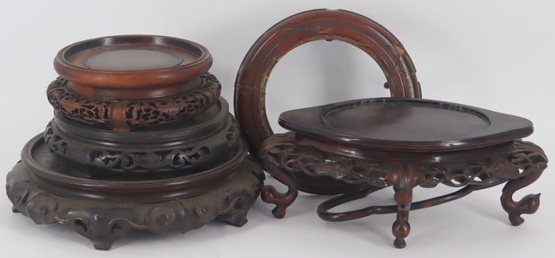 Appraisal: CARVED WOOD ASIAN STANDS Includes carved wood Asian most surely